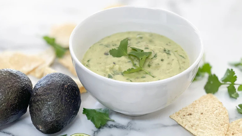 Creamy Avocado Salsa Verde in a white bowl