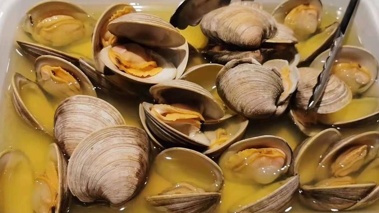 Clams in a pan at Mizumi Buffet & Sushi