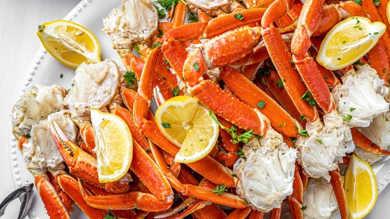 Crab legs with lemon wedges at The Original Benjamin's Calabash Seafood