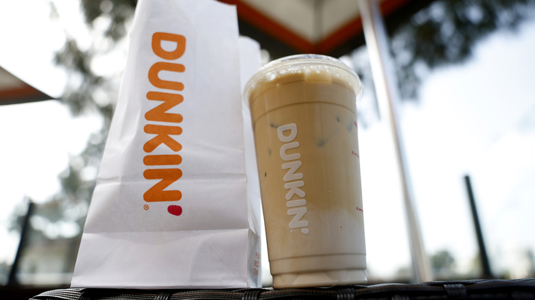 Dunkin' bag with cold brew on table