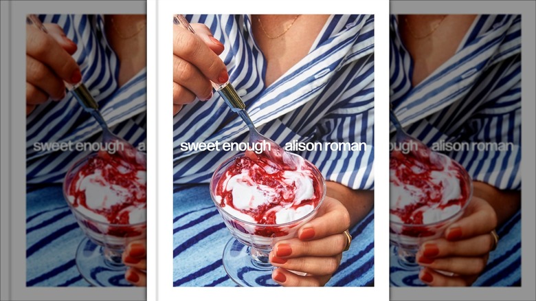 Hand scooping spoonful of dessert parfait on front cover of Sweet Enough cookbook