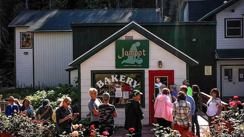 The outside of Jampot showing a cute old-school white building with customers