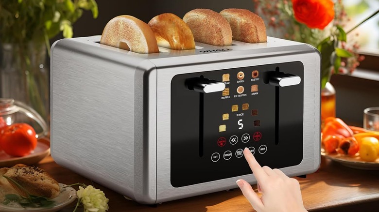 A person setting a Whall toaster