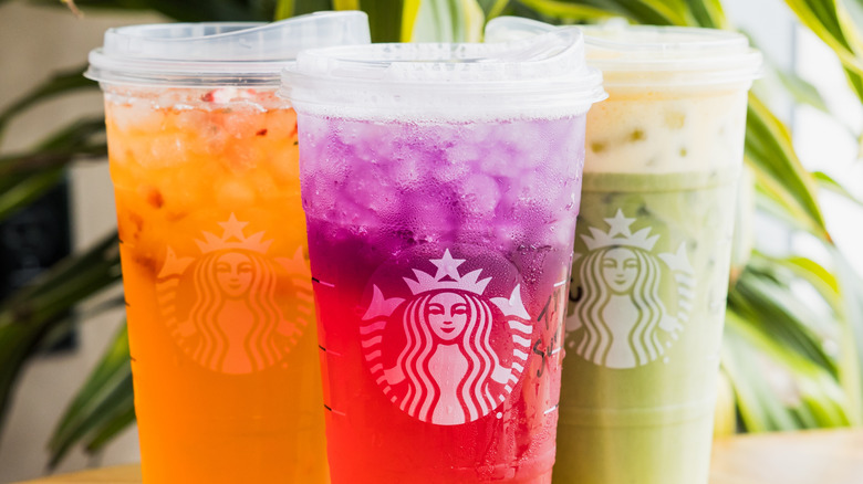 different fruity Starbucks Refreshers in tall to-go cups