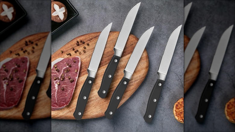 Amazon Basics 8-Piece Steak Knife Set on a cutting board with a cut of meat