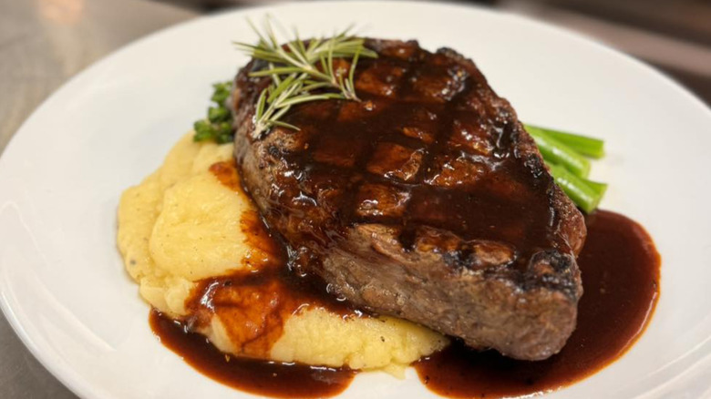 NY strip steak over buttery mash