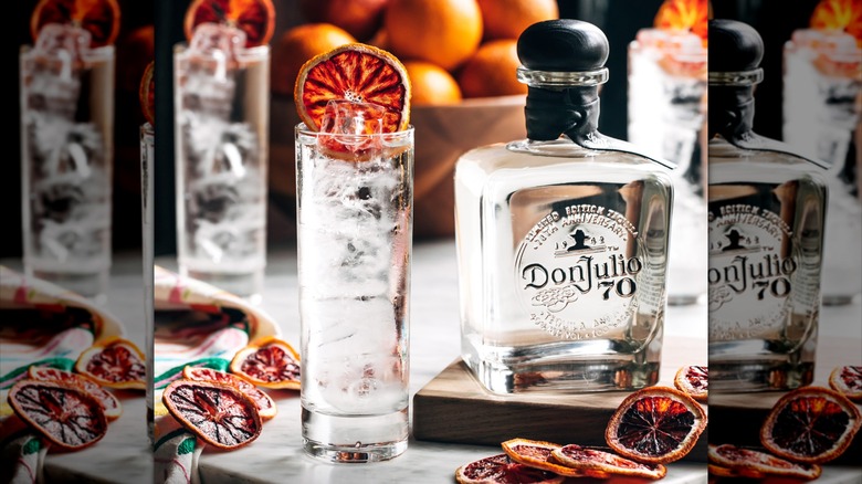 Bottle of Don Julio 70 Cristalino next to a tequila soda