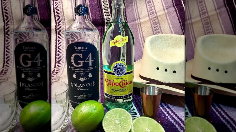 A bottle of G4 blanco with topo chico and limes