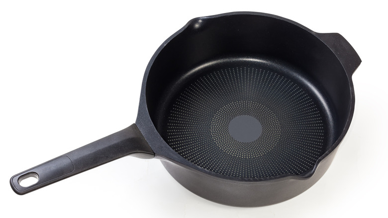 Titanium-reinforced pan