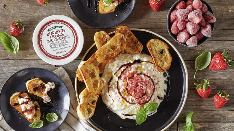 Trader Joe's Burrata Filling stracciatella in tub with sliced baguette and fruit