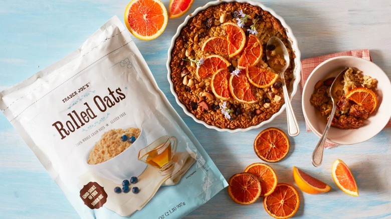 A bag of Trader Joe's rolled oats sits on a table next to baked citrus oats.