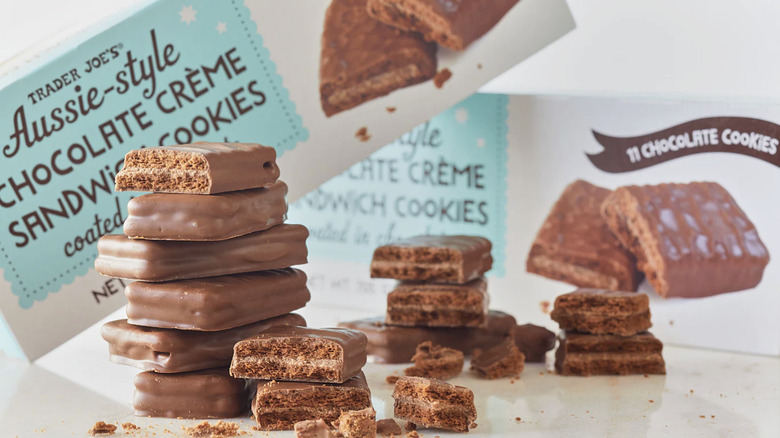 stacks of broken and whole Trader Joe's Aussie-style chocolate sandwich cookies with box in background