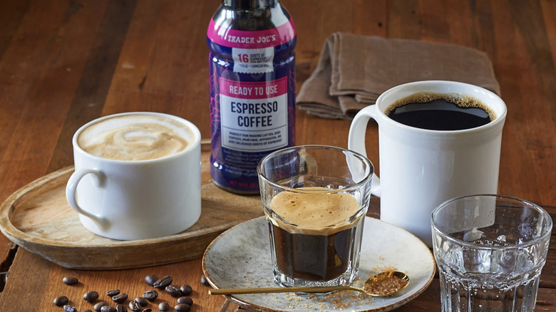 bottle of Trader Joe's Ready to Use Espresso Coffee on table with variety of coffee drinks
