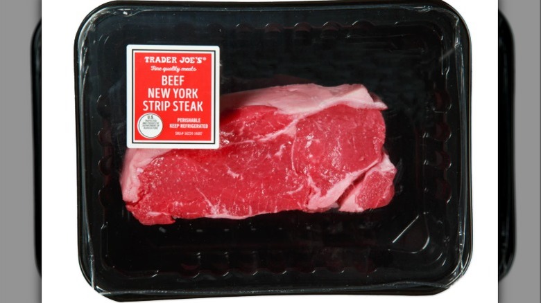 Beef New York Strip Steak on white background