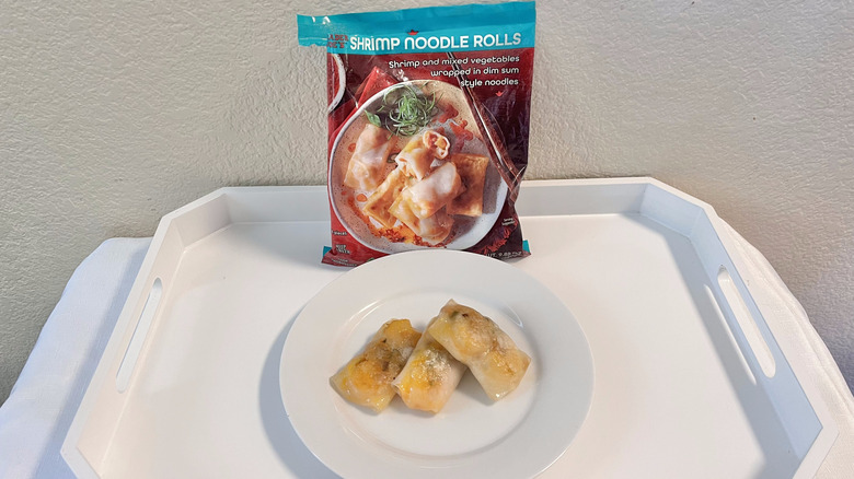 Package of Trader Joe's Shrimp Noodle Rolls next to plate with rolls