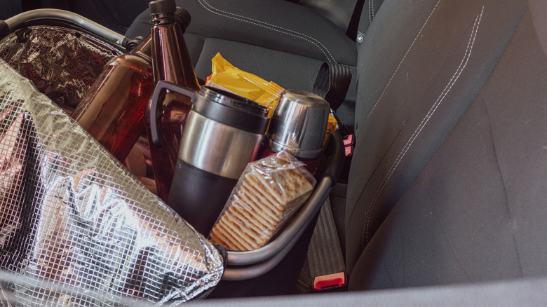 pack of drinks and snacks in car