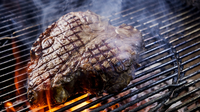 Porterhouse steak on a hot grill