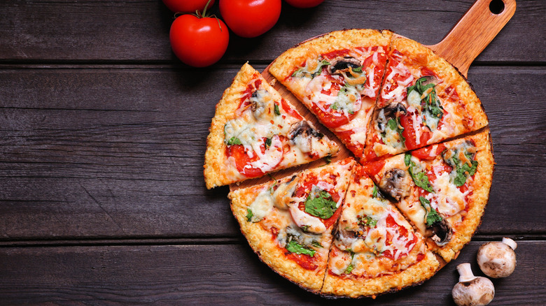 Vegan pizza on wooden board