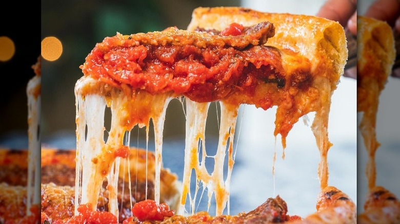 Picking up pizza slice