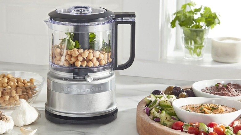 A KitchenAid mini food processor on a counter