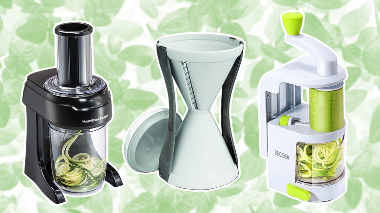 Three veggie spiralizers on green leaf background