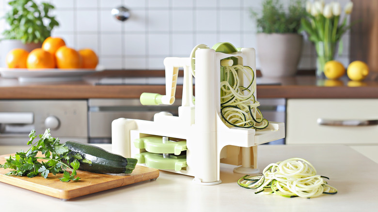 A veggie spiralizer cutting zucchini