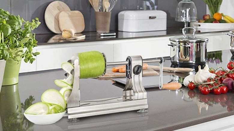 A WellToBe spiralizer slicing an apple