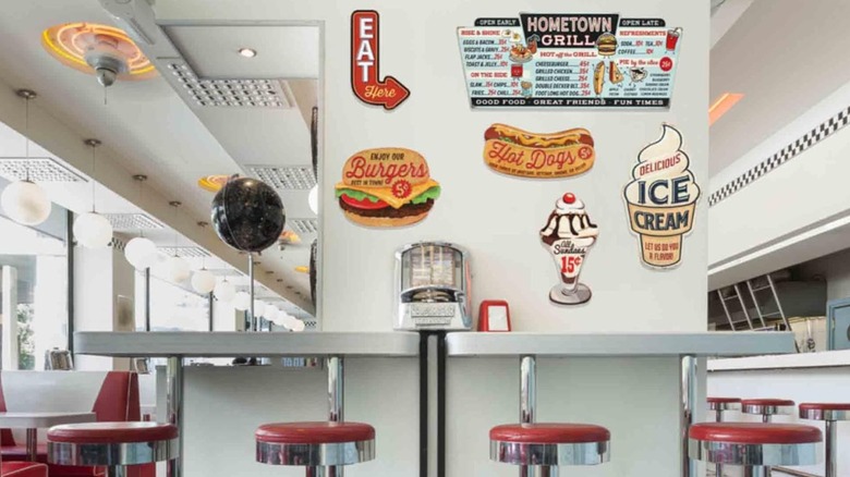 Open Road Vintage Kitchen Signs on a wall at a diner