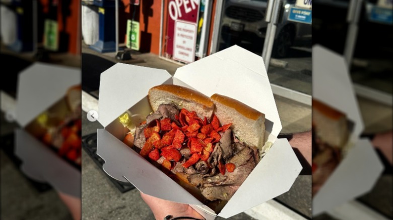 Tri-tip and Frito sandwich in a takeaway container