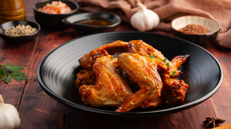 chicken wings on black plate