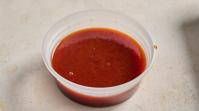 red ranch sauce in a deli container