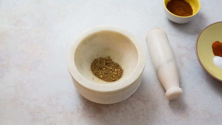 ground spices in gray mortar