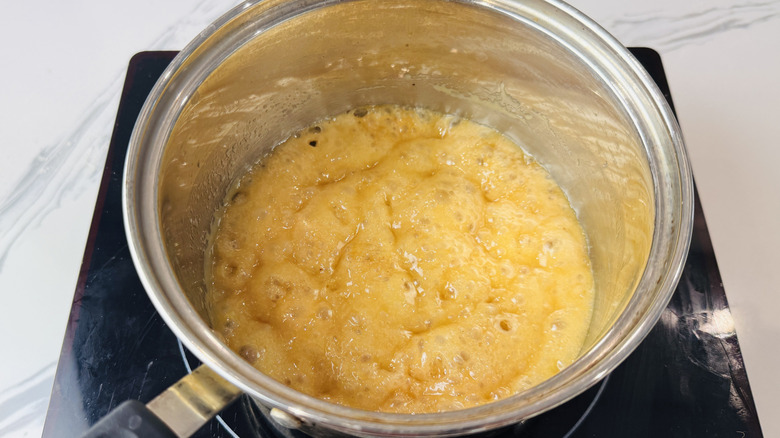 Caramel topping bubbling in pot