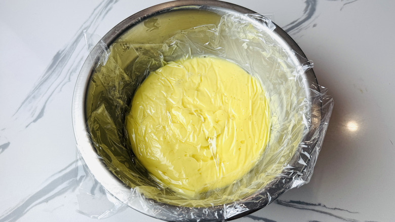 Covered pudding mixture in bowl