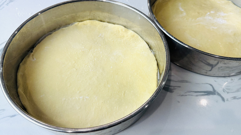 Dough in cake pans