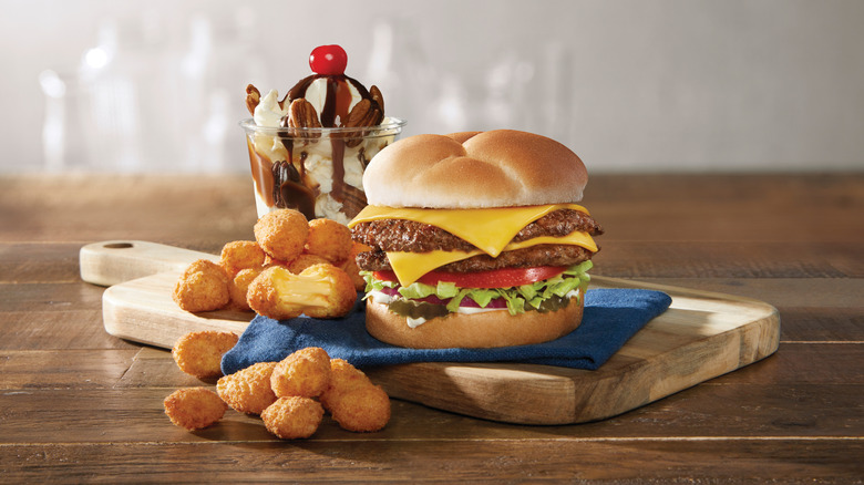Classic Culver's menu items on a wooden cutting board.