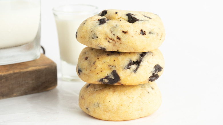 Stack of three large chocolate chip cookies