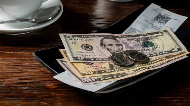 Cash on bar with a reciept