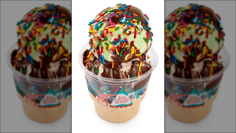 Four scoops of Ice Cream House ice cream covered in chocolate syrup and sprinkles