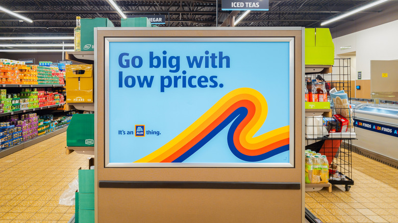 Aldi promotional sign inside a grocery aisle