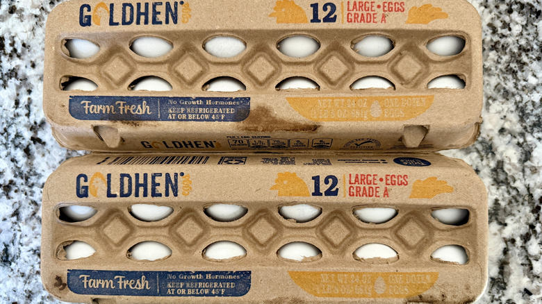 two boxes of goldhen eggs on kitchen counter