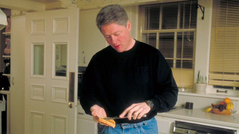 Bill Clinton making sandwich
