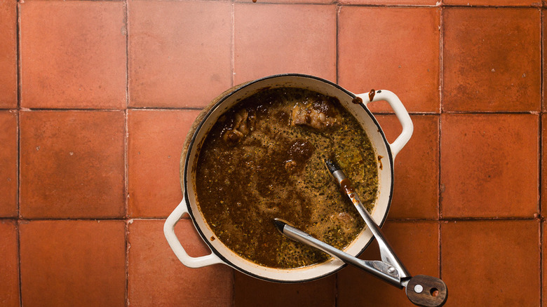 Beef with sauce in Dutch oven