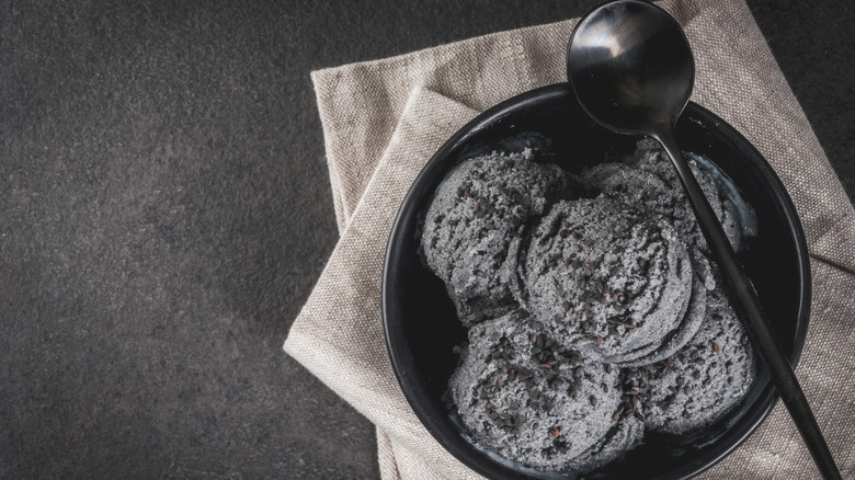 Dish filled with scoops of black ice cream