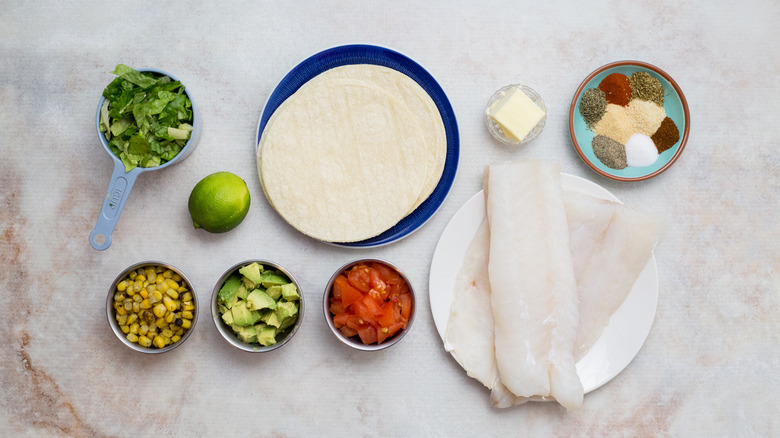 Blackened fish taco ingredients on table