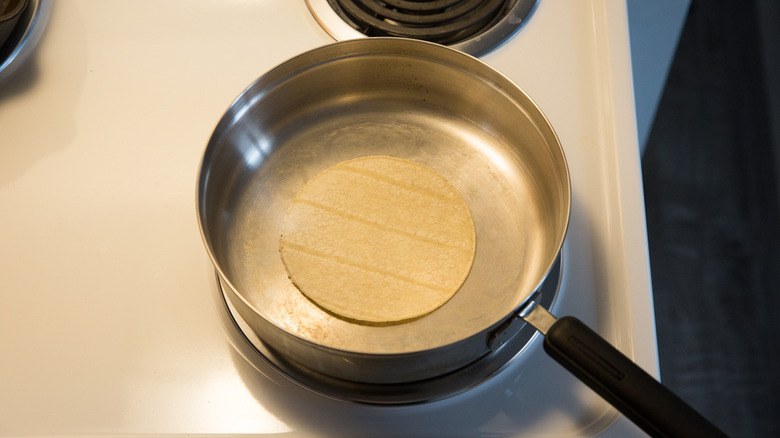tortilla warming in stovetop pan
