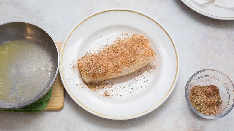 seasoned cod on white plate