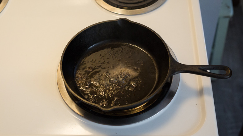 butter melting in cast iron pan