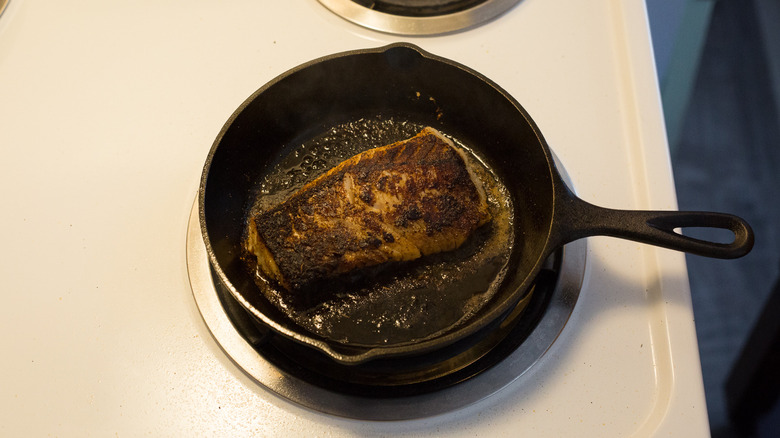 blackened fish in iron pan