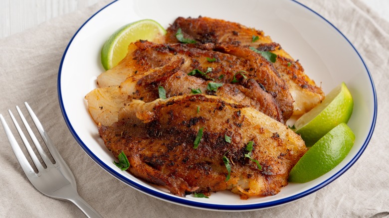 Blackened tilapia with lime slices